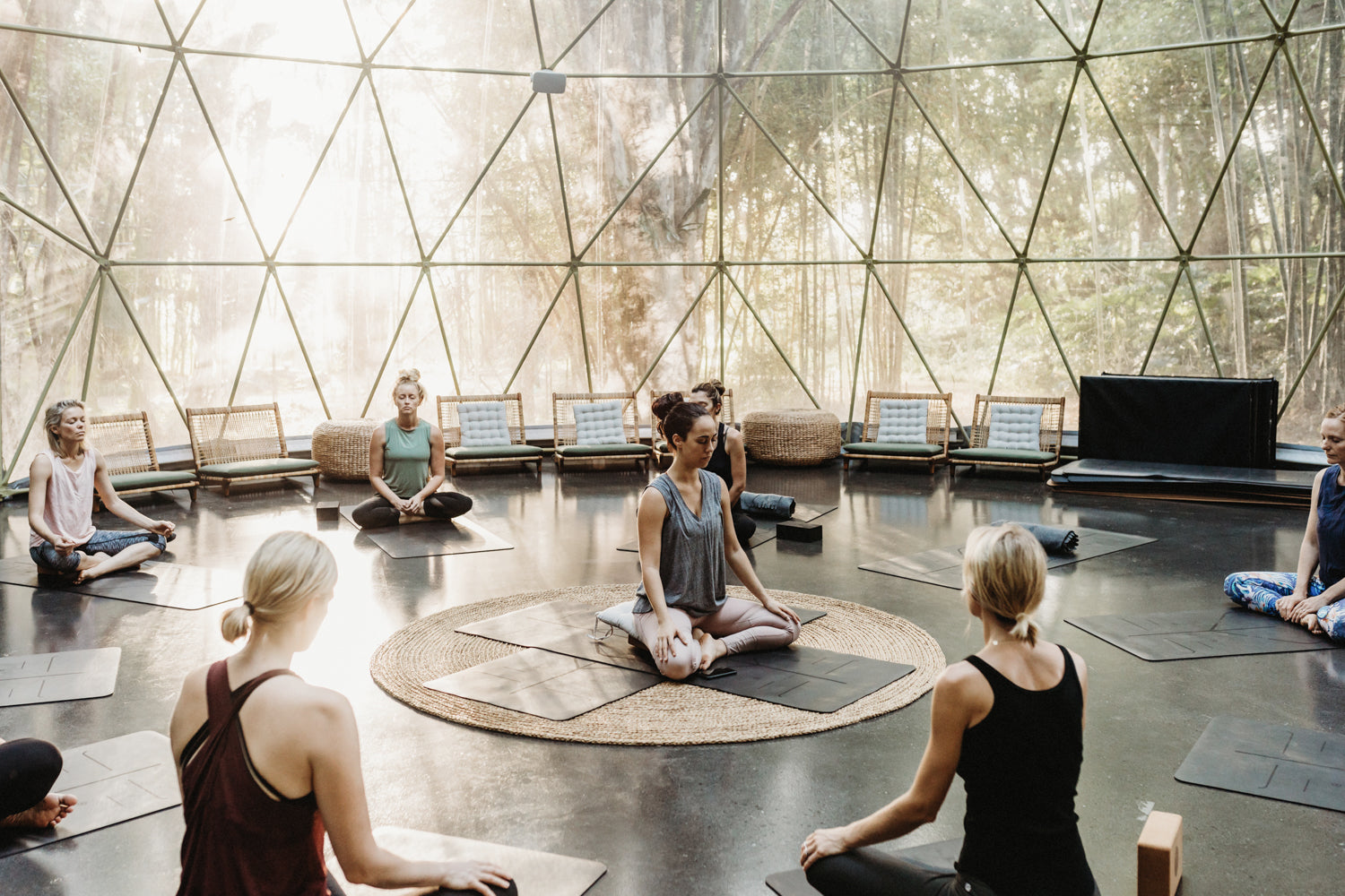 MATRESSENCE RETREAT - women practicing yoga in the SOMA Dome